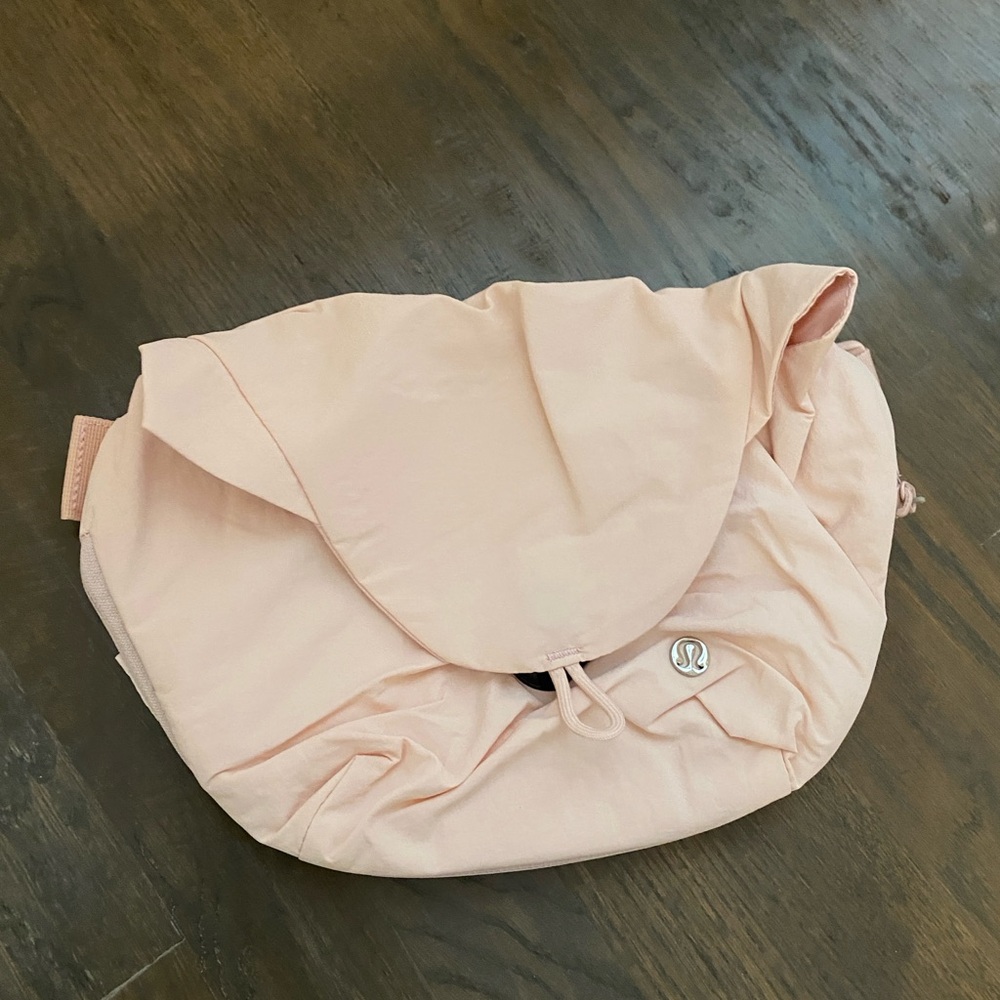Lululemon curved crossbody bag pink color